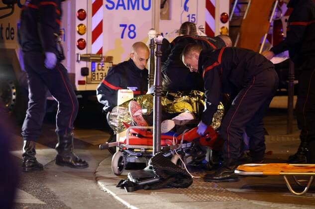 Nov. 14, 2015 - Paris, France - CORBIS OUT = Victims of the shooting at the Bataclan concert venue in central Paris are being evacuated to receive first aid. More than one hundred people were killed and many more wounded when gunmen opened fire inside the venue as the French capital has been the target of a series of deadly attacks. Paris France - ZUMAv111