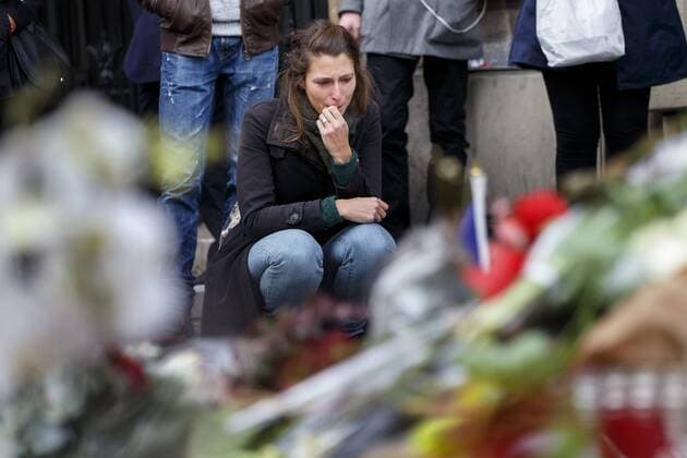 Nov. 16, 2015 - Paris, France - Paris, France. Mourners visit a memorial outside Bataclan Cafe in Paris, France following the Paris terror attacks on Monday, 16 November 2015. Paris  - ZUMAl94_