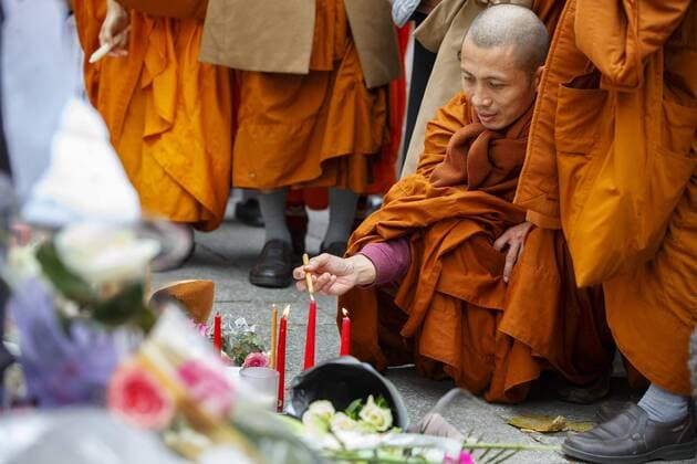 Nov. 16, 2015 - Paris, France - Paris, France. Buddhist monks visit a memorial outside Bataclan Cafe in Paris, France following the Paris terror attacks on Monday, 16 November 2015. Paris  - ZUMAl94_