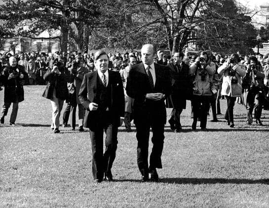 No UK - No US: FILE PHOTO: United States President Gerald R. Ford and Chancellor Helmut Schmidt of Germany listen as the Nationals Anthems of their respective countries are played on the South Lawn of the White House in Washington, DC during the Arrival Ceremony on December 5, 1974. Schmidt is scheduled to speak with the President about the oil problem and the economy. Photo Credit: BarrySoorenko CNP AdMedia  BarryxSoorenko CNP AdMedia CNP A