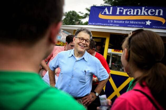 Aug. 21, 2014 - Lakeville, Minnesota, U.S. - DFL Senator Al Franken handed out fans with his smiling image on them and greeted supporters in front of his booth Thursday morning at the first day of the State Fair. FALCON HEIGHTS, MN -- Thursday, August 21, 2014. GLEN STUBBE gstubbe@startribune.com - ZUMAm42