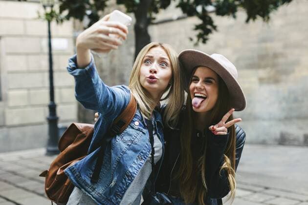 Youniverse - Urban Lifestyle Two playful young women taking a selfie  EBSF000950