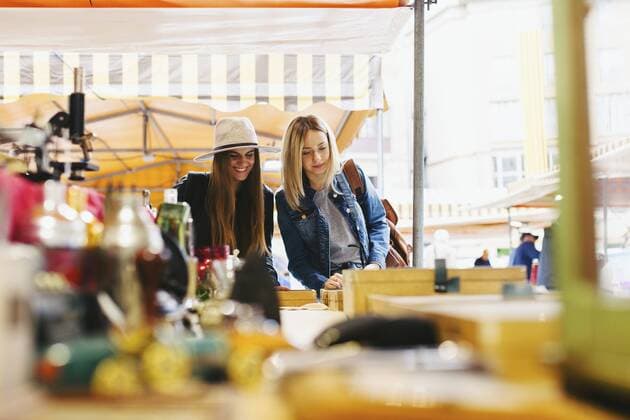 Two young women at a stall on flea market  EBSF000962