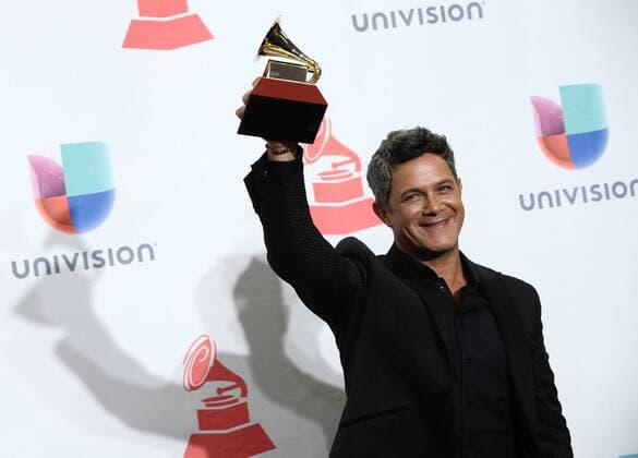 Alejandro Sanz poses in the pressroom with the award for best contemporary pop vocal album for Sirope during the 16th Annual Latin Grammy Awards at the MGM Grand Garden Arena in Las Vegas, Nevada on November 19, 2015.  LAV20151119534 JIMxRUYMEN