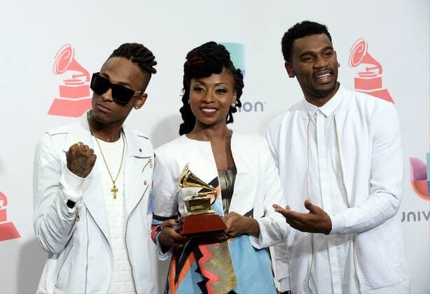 Chocquibtown poses in the pressroom with the award for Best Tropical Fusion Album for Elmiso during the 16th Annual Latin Grammy Awards at the MGM Grand Garden Arena in Las Vegas, Nevada on November 19, 2015.  LAV20151119547 JIMxRUYMEN