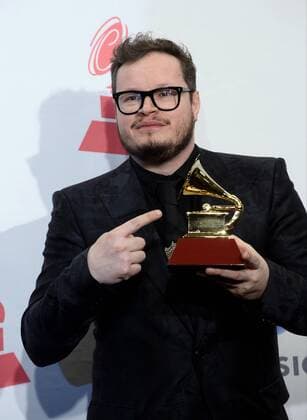Leonel Garcia poses in the pressroom with the Song of the Year Award for Hasta La Raiz during the 16th Annual Latin Grammy Awards at the MGM Grand Garden Arena in Las Vegas, Nevada on November 19, 2015.  LAV20151119580 JIMxRUYMEN