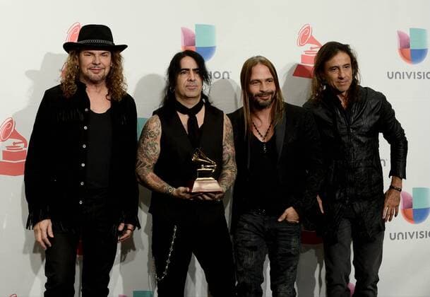Mana poses in the pressroom with the Best Pop Rock Album Award for Cama Incendiada during the 16th Annual Latin Grammy Awards at the MGM Grand Garden Arena in Las Vegas, Nevada on November 19, 2015.  LAV20151119582 JIMxRUYMEN