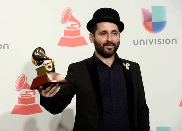 Director Kacho Lopez poses in the pressroom with the Best Short Form Music Video Award for Ojos Color Sol during the 16th Annual Latin Grammy Awards at the MGM Grand Garden Arena in Las Vegas, Nevada on November 19, 2015.  LAV20151119611 JIMxRUYMEN