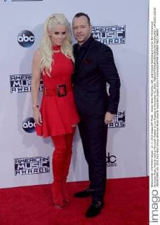 Actors Jenny McCarthy, left, and Donnie Wahlberg arrive for the 43rd annual American Music Awards held at Microsoft Theater in Los Angeles on November 22, 2015.  LAP20151122132 JIMxRUYMEN