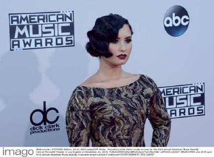 Recording artist Demi Lovato arrives for the 43rd annual American Music Awards held at Microsoft Theater in Los Angeles on November 22, 2015.  LAP20151122147 JIMxRUYMEN