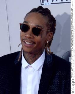 Recording artist Wiz Khalifa arrives for the 43rd annual American Music Awards held at Microsoft Theater in Los Angeles on November 22, 2015.  LAP20151122185 JIMxRUYMEN