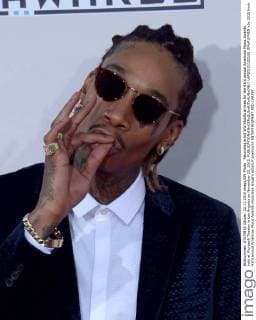 Recording artist Wiz Khalifa arrives for the 43rd annual American Music Awards held at Microsoft Theater in Los Angeles on November 22, 2015.  LAP20151122188 JIMxRUYMEN