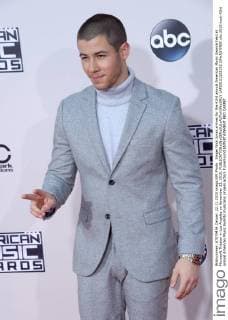 Singer Nick Jonas arrives for the 43rd annual American Music Awards held at Microsoft Theater in Los Angeles on November 22, 2015.  LAP20151122192 JIMxRUYMEN
