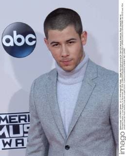 Singer Nick Jonas arrives for the 43rd annual American Music Awards held at Microsoft Theater in Los Angeles on November 22, 2015.  LAP20151122193 JIMxRUYMEN