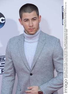 Singer Nick Jonas arrives for the 43rd annual American Music Awards held at Microsoft Theater in Los Angeles on November 22, 2015.  LAP20151122194 JIMxRUYMEN