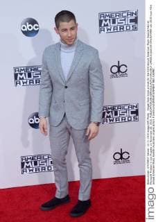 Singer Nick Jonas arrives for the 43rd annual American Music Awards held at Microsoft Theater in Los Angeles on November 22, 2015.  LAP20151122195 JIMxRUYMEN