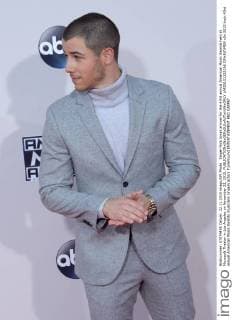 Singer Nick Jonas arrives for the 43rd annual American Music Awards held at Microsoft Theater in Los Angeles on November 22, 2015.  LAP20151122196 JIMxRUYMEN