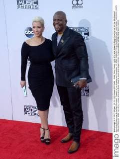 Actor Terry Crews, right, and wife Rabecca King-Crews arrive for the 43rd annual American Music Awards held at Microsoft Theater in Los Angeles on November 22, 2015.  LAP20151122275 JIMxRUYMEN