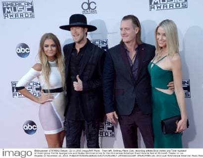 From left, Brittney Marie Cole, recording artists Brian Kelley and Tyler Hubbard of music group Florida Georgia Line and Hayley Stommel arrive for the 43rd annual American Music Awards held at Microsoft Theater in Los Angeles on November 22, 2015.  LAP20151122284 JIMxRUYMEN