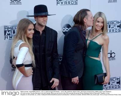 From left, Brittney Marie Cole, recording artists Brian Kelley and Tyler Hubbard of music group Florida Georgia Line and Hayley Stommel arrive for the 43rd annual American Music Awards held at Microsoft Theater in Los Angeles on November 22, 2015.  LAP20151122285 JIMxRUYMEN