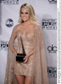 Recording artist Carrie Underwood, winner of Favorite Country Female Artist, appears backstage during the 43rd annual American Music Awards held at Microsoft Theater in Los Angeles on November 22, 2015.  LAP20151122431 JIMxRUYMEN