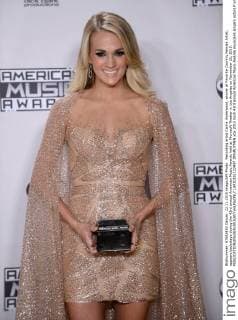 Recording artist Carrie Underwood, winner of Favorite Country Female Artist, appears backstage during the 43rd annual American Music Awards held at Microsoft Theater in Los Angeles on November 22, 2015.  LAP20151122437 JIMxRUYMEN
