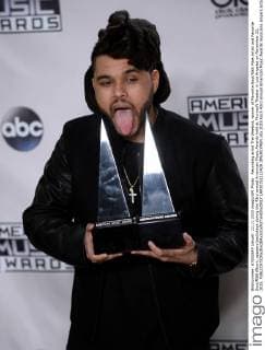 Recording artist The Weeknd, winner of Favorite Soul R&B Male Artist and Favorite Soul R&B Album, appears backstage during the 43rd annual American Music Awards held at Microsoft Theater in Los Angeles on November 22, 2015.  LAP20151122429 JIMxRUYMEN