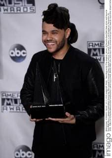 Recording artist The Weeknd, winner of Favorite Soul R&B Male Artist and Favorite Soul R&B Album, appears backstage during the 43rd annual American Music Awards held at Microsoft Theater in Los Angeles on November 22, 2015.  LAP20151122430 JIMxRUYMEN