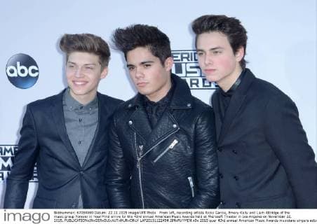 From left, recording artists Ricky Garcia, Emery Kelly and Liam Attridge of the music group Forever in Your Mind arrive for the 43rd annual American Music Awards held at Microsoft Theater in Los Angeles on November 22, 2015.  LAP20151122494 JIMxRUYMEN