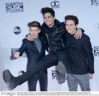 From left, recording artists Ricky Garcia, Emery Kelly and Liam Attridge of the music group Forever in Your Mind arrive for the 43rd annual American Music Awards held at Microsoft Theater in Los Angeles on November 22, 2015.  LAP20151122495 JIMxRUYMEN