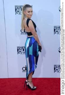 Actress Olivia Holt arrives for the 43rd annual American Music Awards held at Microsoft Theater in Los Angeles on November 22, 2015.  LAP20151122512 JIMxRUYMEN