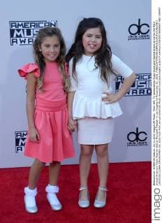 From left, TV personalities Rosie Grace and Sophia Grace arrive for the 43rd annual American Music Awards held at Microsoft Theater in Los Angeles on November 22, 2015.  LAP20151122564 JIMxRUYMEN