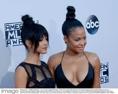 From left, actress Karrueche Tran and recording artist Christina Milian arrive for the 43rd annual American Music Awards held at Microsoft Theater in Los Angeles on November 22, 2015.  LAP20151122523 JIMxRUYMEN