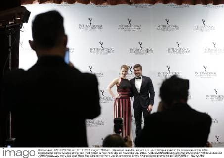 Presenter Leandra Leal and Lourenco Ortigao stand in the pressroom at the 43rd International Emmy Awards at the New York Hilton in New York City on November 23, 2015.  NYP20151123163 JOHNxANGELILLO
