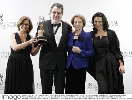 Award Winners for Comedy for Doce de Mae ( Sweet Mother ) including Jorge Furtado, Fernanda Montenegro (C) and Ana Luiza Azevedo hold an International Emmy Award in the pressroom at the 43rd International Emmy Awards at the New York Hilton in New York City on November 23, 2015.  NYP20151123153 JOHNxANGELILLO