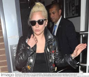American singer-songwriter and actress Lady Gaga is pictured as she leaves a London recording studio. The 29-year-old, who covers her face with large sunglasses, looks punky wearing a leather jacket, a black leotard, fishnet tights and lace up boots. NOVEMBER 24th 2015  LTNx153504