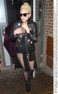 American singer-songwriter and actress Lady Gaga is pictured as she leaves a London recording studio. The 29-year-old, who covers her face with large sunglasses, looks punky wearing a leather jacket, a black leotard, fishnet tights and lace up boots. NOVEMBER 24th 2015  LTNx153504
