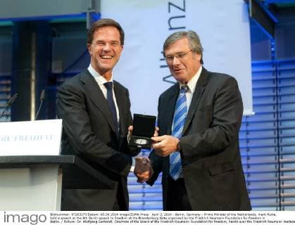 April 3, 2014 - Berlin, Germany - Prime Minister of the Netherlands, mark Rutte, hold a speech at the 8th Berlin speech to freedom at the Brandenburg Gate organized by the Friedrich Naumann Foundation for freedom in Berlin. Picture: Dr. Wolfgang Gerhardt, Chairman of the Board of the Friedrich Naumann Foundation for freedom, hands over the Friedrich Naumann medalie to Netherlands Prime Minister Mark Rutte.  - ZUMAn23