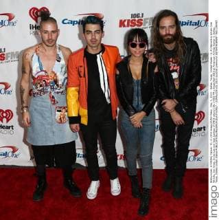 Dec. 1, 2015 - Dallas, Texas, United States - (L-R) Recording artists Cole Whittle, Joe Jonas, JinJoo Lee and Jack Lawless of DNCE attend 106.1 KISS FM s Jingle Ball 2015 at American Airlines Center in Dallas, Texas. Dallas United States - ZUMAw109