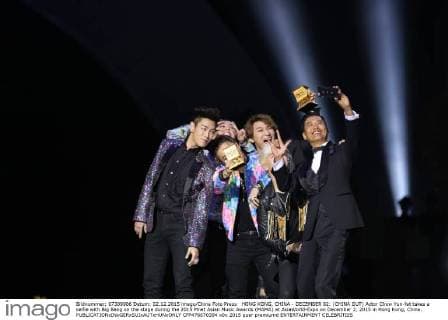 HONG KONG, CHINA - DECEMBER 02: (CHINA OUT) Actor Chow Yun-fat takes a selfie with Big Bang on the stage during the 2015 Mnet Asian Music Awards (MAMA) at AsiaWorld-Expo on December 2, 2015 in Hong Kong, China.  CFP476670394