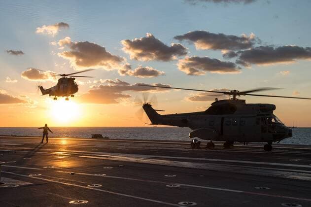 PARIS, Dec. 4, 2015 -- This picture released on Dec. 4, 2015 by the French Defense Audiovisual Communication and Production Unit () shows the helicopter carrying French President Francois Hollande arriving at France s Charles de Gaulle aircraft carrier on Dec. 4, 2015 off the coast of Syria. Last month, in the wake of the terrorist attacks in Paris that killed 130 people, Hollande sent France s only aircraft carrier to the eastern Mediterranean to boost its military operation against the Islamic State in Syria and Iraq. ) FRANCE-PRESIDENT-AIRCRAFT CARRIER ECPAD 