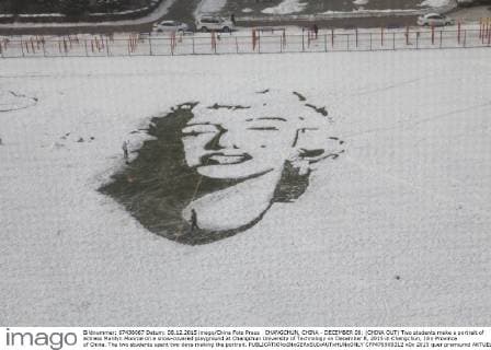 CHANGCHUN, CHINA - DECEMBER 08: (CHINA OUT) Two students make a portrait of actress Marilyn Monroe on a snow-covered playground at Changchun University of Technology on December 8, 2015 in Changchun, Jilin Province of China. The two students spent two days making the portrait.  CFP476909312