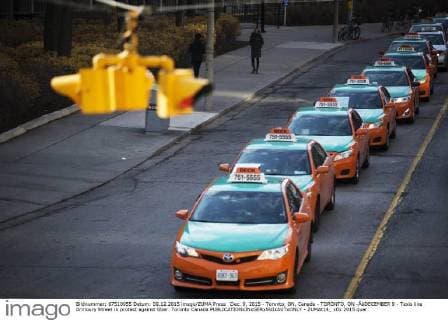 Dec. 9, 2015 - Toronto, ON, Canada - TORONTO, ON -ÃäDECEMBER 9 - Taxis line Armoury Street in protest against Uber. Toronto Canada  - ZUMAt14_