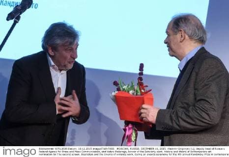 MOSCOW, RUSSIA. DECEMBER 10, 2015. Vladimir Grigoryev (L), deputy head of Russia s Federal Agency for Press and Mass Communication, and Valery Podoroga, winner of the Scholarly work. History and theory of contemporary art nomination for The second screen. Eisenstein and the cinema of violence work, during an awards ceremony for the 9th annual Kandinsky Prize in contemporary art at the Udarnik Cinema. Vyacheslav Prokofyev TASS  TS01385A
