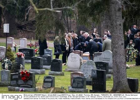 Dec. 10, 2015 - Toronto, ON, Canada - TORONTO, ON - DECEMBER 10 - Nicole Wellwood at the gravesite of her seven-year-old son Evan Leversage, at St. George Cemetery in St. George, Ontario, December 10, 2015. Evan, who battled brain cancer for most of his young life, made headlines internationally when homes and businesses in the Ontario town put their Christmas decorations up in October, after doctors told his family he was unlikely to live to Christmas and they should celebrate early. Toronto Canada - ZUMAt14_
