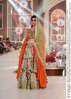 (151211) -- LAHORE, Dec. 11, 2015 -- A model presents a creation by Pakistani designer Zarmisha Dar on the first day of the Fashion Bridal Couture Week in eastern Pakistan s Lahore on Dec. 11, 2015. ) PAKISTAN-LAHORE-BRIDAL COUTURE WEEK JamilxAhmed 