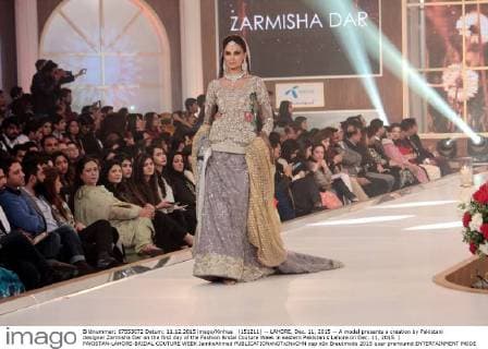 (151211) -- LAHORE, Dec. 11, 2015 -- A model presents a creation by Pakistani designer Zarmisha Dar on the first day of the Fashion Bridal Couture Week in eastern Pakistan s Lahore on Dec. 11, 2015. ) PAKISTAN-LAHORE-BRIDAL COUTURE WEEK JamilxAhmed 