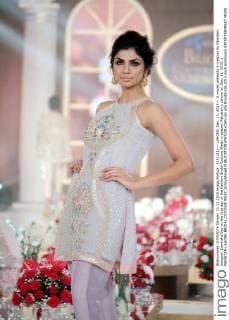 (151211) -- LAHORE, Dec. 11, 2015 -- A model presents a creation by Pakistani designer Zarmisha Dar on the first day of the Fashion Bridal Couture Week in eastern Pakistan s Lahore on Dec. 11, 2015. ) PAKISTAN-LAHORE-BRIDAL COUTURE WEEK JamilxAhmed 
