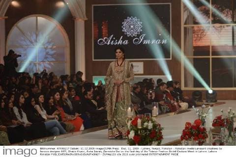 Dec. 11, 2015 - Lahore, Punjab, Pakistan - Pakistani models present creations by famous designer HSY, Shazia Kiyani, Aisha Imran, Zarmisha Dar on the first day of the Telenor Fashion Bridal Couture Week in Lahore. Lahore Pakistan - ZUMAp133
