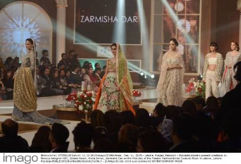 Dec. 11, 2015 - Lahore, Punjab, Pakistan - Pakistani models present creations by famous designer HSY, Shazia Kiyani, Aisha Imran, Zarmisha Dar on the first day of the Telenor Fashion Bridal Couture Week in Lahore. Lahore Pakistan - ZUMAp133